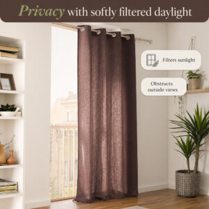 Daylight filtering through the mocha brown cotton panel for window privacy