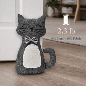 Charcoal cat door stopper propping a white door, with a door icon. On-image text: "2.3 lb," "90% Sand + 10% Fabric."