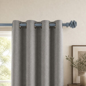 Blue gray spiral ball finial curtain rod with grommet panels on a living room window