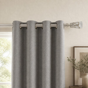 Silver frosted leaf finial curtain rod with grommet panels on a living room window