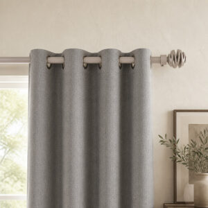 Taupe spiral ball finial curtain rod with grommet panels on a living room window
