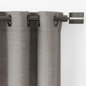 Close-up of grey grommet drapery sliding on the graphite curtain rod with jeweled square finial