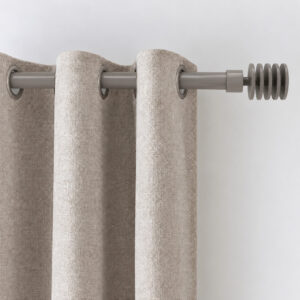 Ivory grommet drapery sliding on the taupe 1 inch steel window rod, close-up