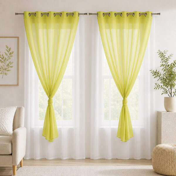 Sunlit room with the set of 2 lime green and white sheer curtains filtering daylight
