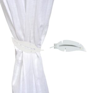 metal feather tieback on white curtain