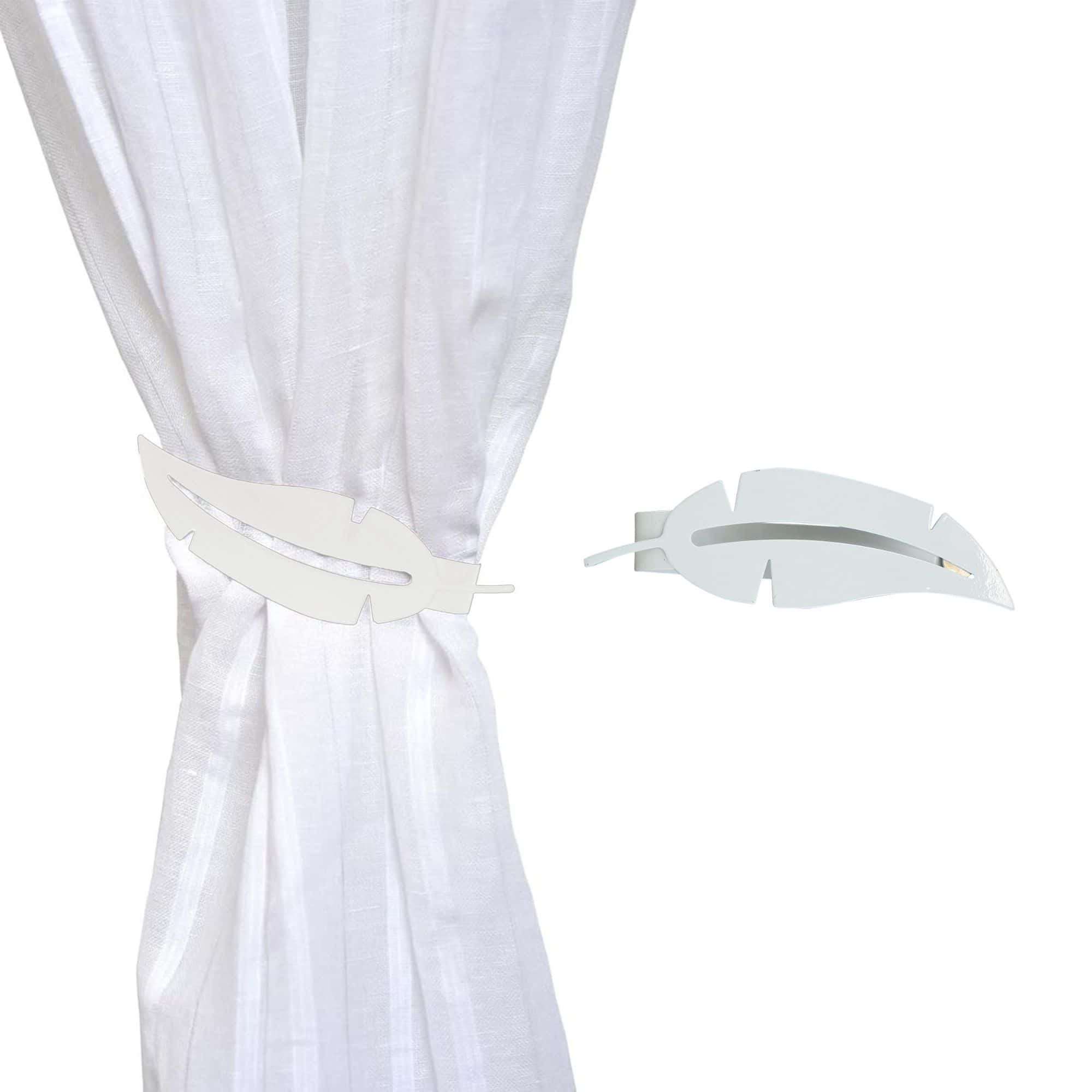 metal feather tieback on white curtain