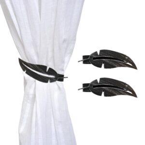 metal feather tiebacks on white curtain