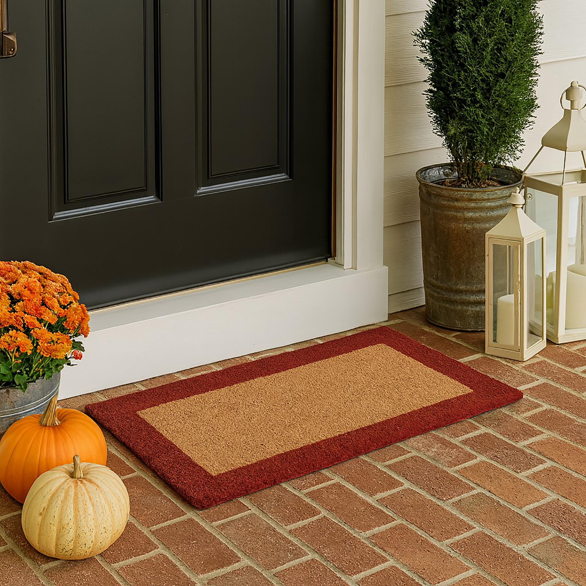 Red-border coir doormat 24x13 placed at front door on brick porch