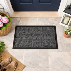 Gray checkerboard doormat placed in front of a navy entry door