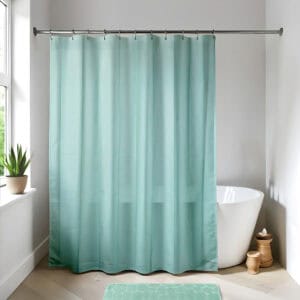 Almond green shower curtain in a bright modern bathroom
