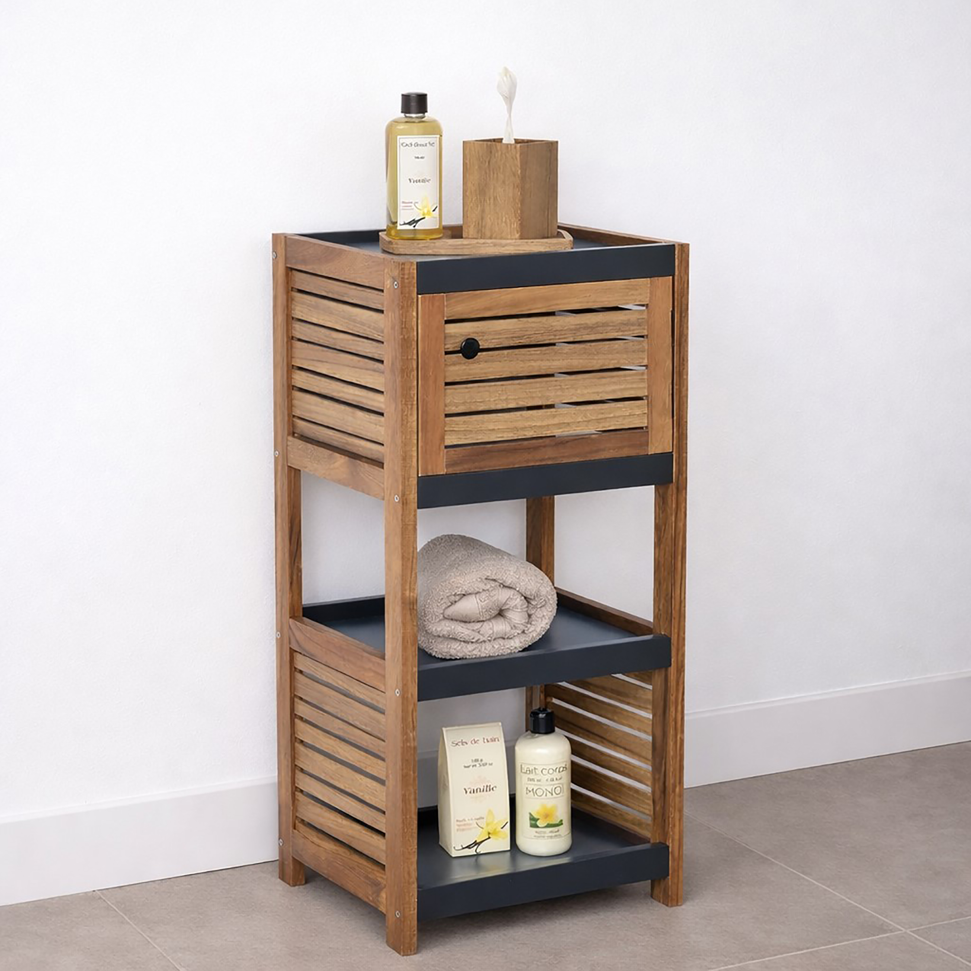 "Acacia wood bathroom storage unit styled with toiletries, a towel, and bath products on open shelves"