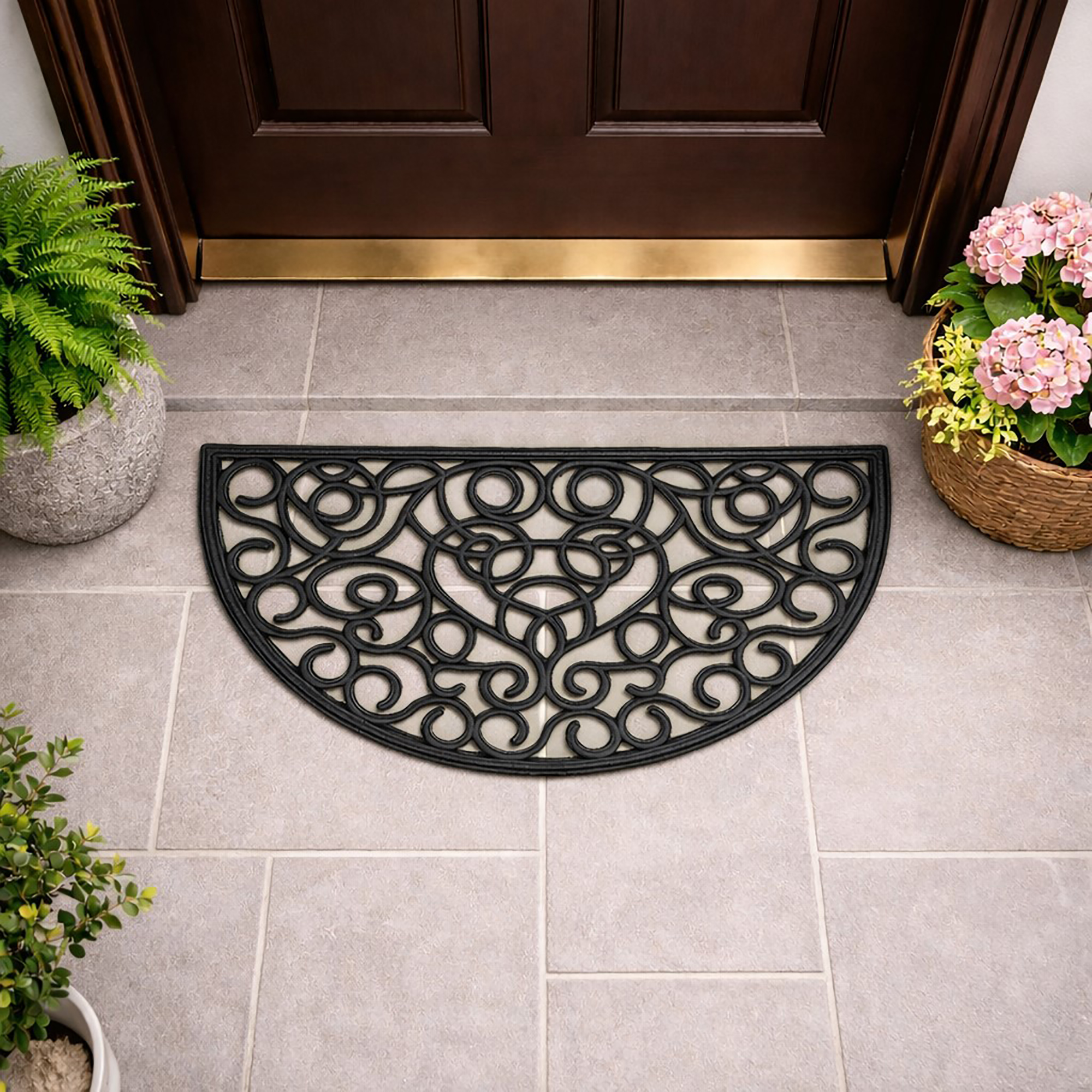 Half round rubber door mat placed in front of a wooden entry door