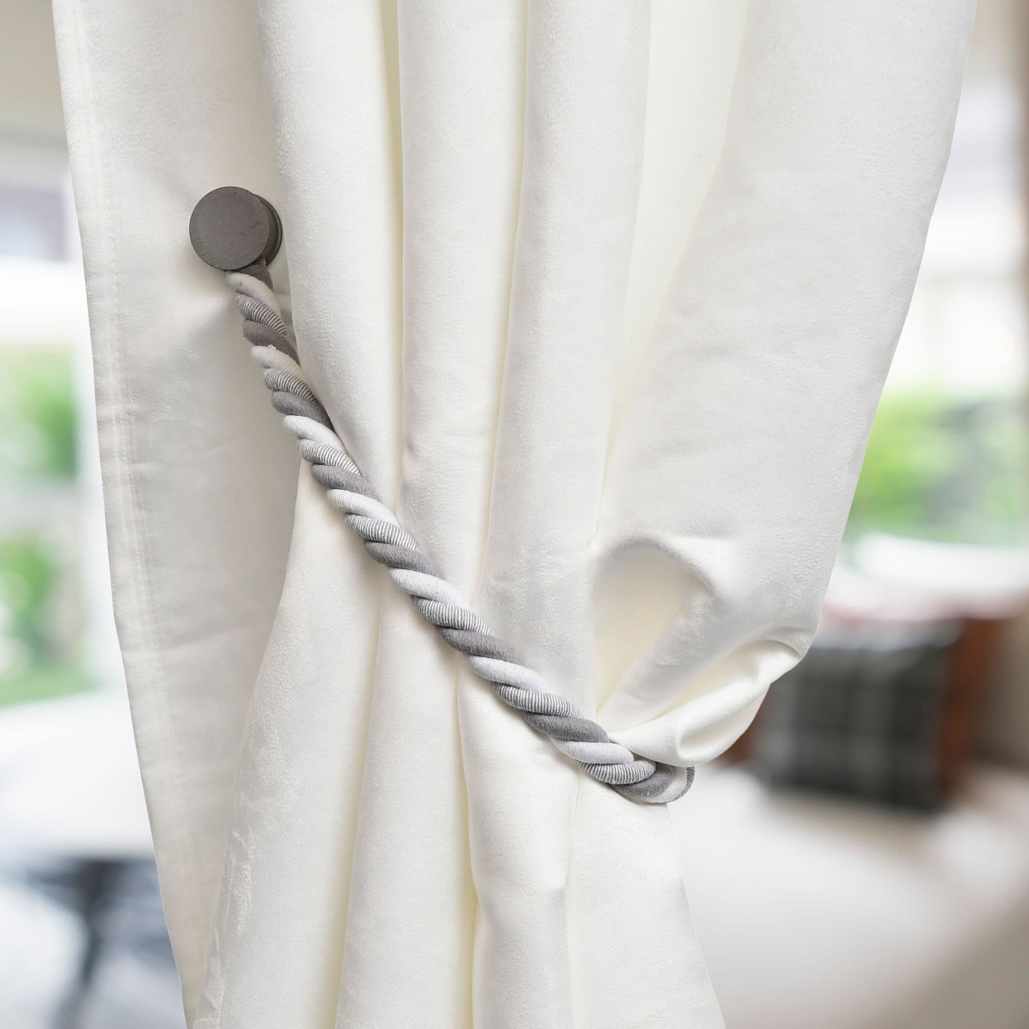 braided holdback on white curtain