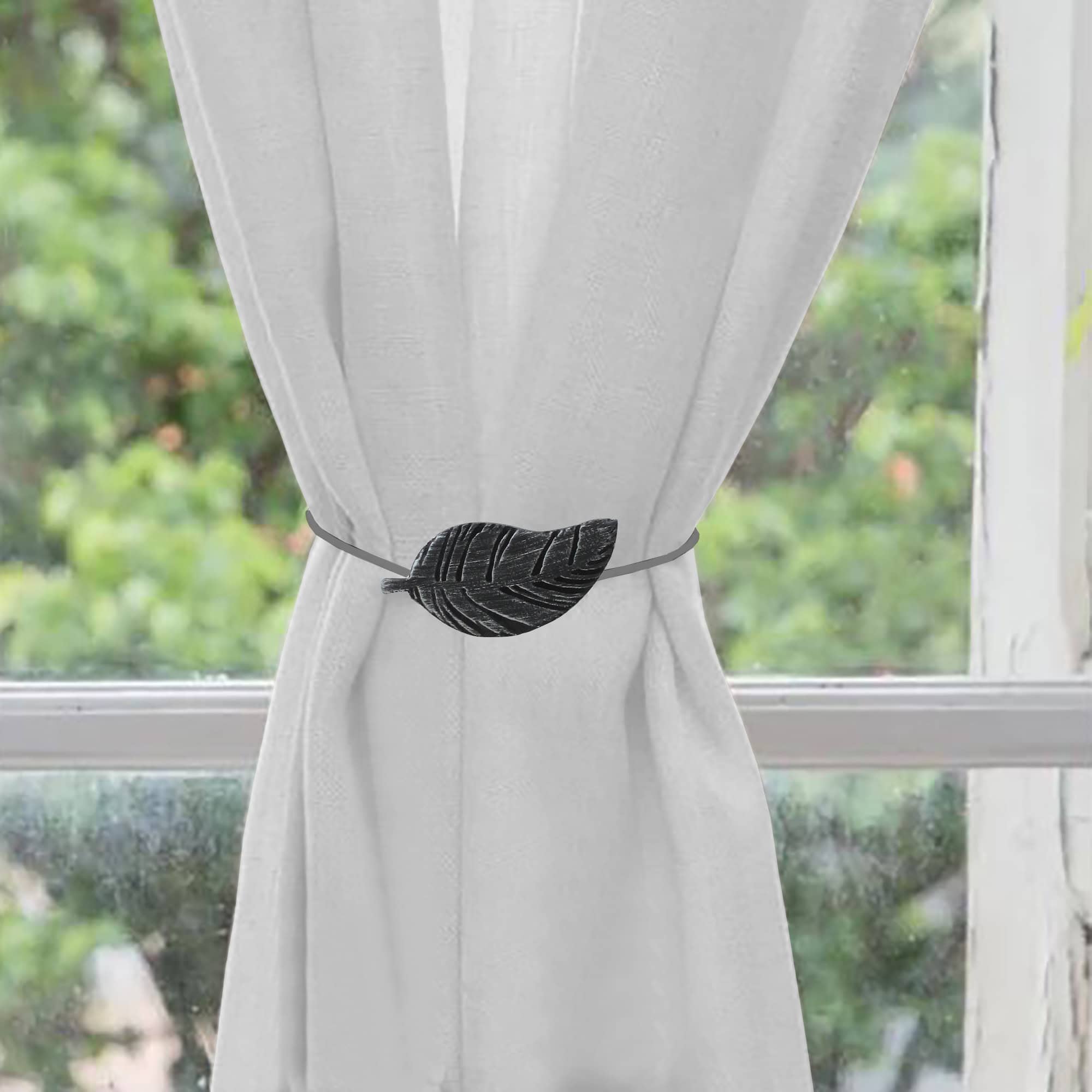 wooden curtain holdback on white curtain