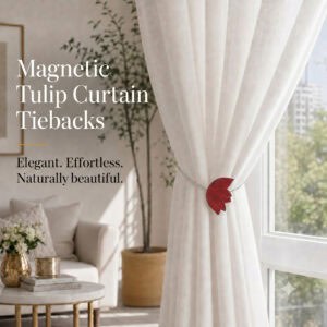 lifestyle: Red resin tulip magnetic tieback holding a flowing sheer curtain beside a sunlit window in a bright neutral living room.