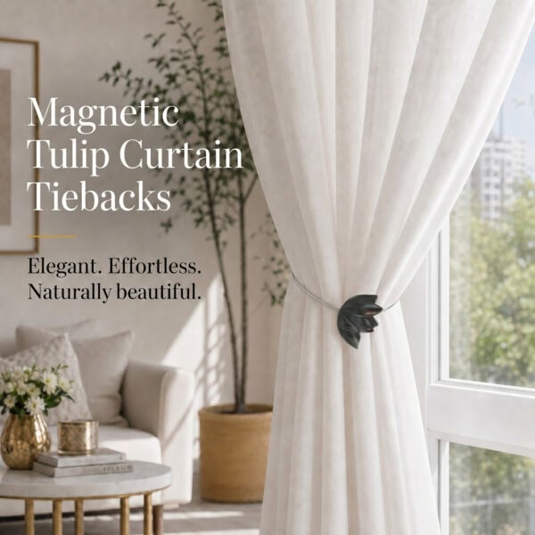 lifestyle: Black resin tulip magnetic tieback holding a flowing sheer curtain beside a sunlit window in a bright neutral living room.