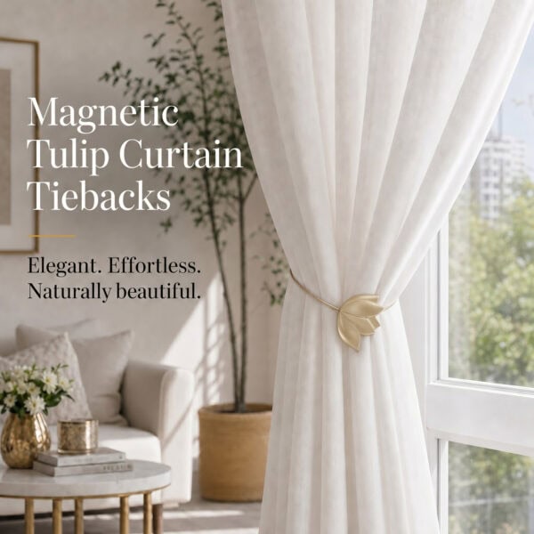 lifestyle: Gold resin tulip magnetic tieback holding a flowing sheer curtain beside a sunlit window in a bright neutral living room.