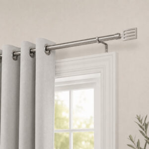 Silver curtain rod mounted above a window with grey grommet curtains in a bedroom