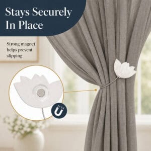 magnet hold: Close up of the white tulip tieback showing the hidden round magnet that grips the cable and helps prevent the curtain from slipping.