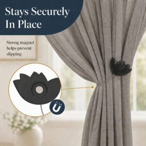 magnet hold: Close up of the black tulip tieback showing the hidden round magnet that grips the cable and helps prevent the curtain from slipping.