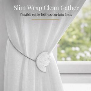 cable wrap: White tulip tieback with its slim flexible cable wrapped neatly around a white sheer curtain, following the natural folds of the fabric.