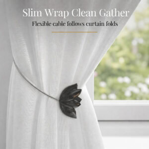 cable wrap: Black tulip tieback with its slim flexible cable wrapped neatly around a white sheer curtain, following the natural folds of the fabric.