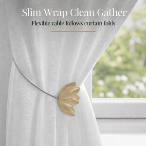cable wrap: Gold tulip tieback with its slim flexible cable wrapped neatly around a white sheer curtain, following the natural folds of the fabric.