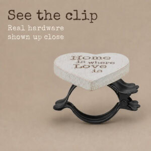 5- Close-up of the black metal spring clip hardware behind the wooden heart curtain tieback