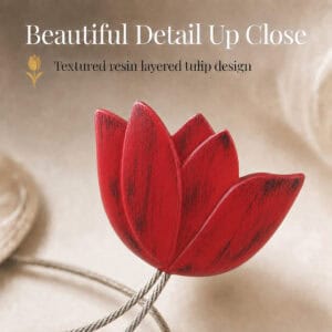 texture detail: Macro view of the layered resin tulip in red, showing the textured petals and brushed finish of the curtain tieback flower.