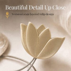 texture detail: Macro view of the layered resin tulip in gold, showing the textured petals and brushed finish of the curtain tieback flower.
