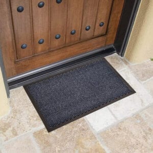 Blue outdoor front door mat on stone entry for heavy traffic use