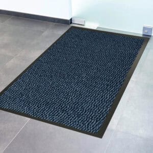 Close-up of blue textured door mat surface with black non-slip border