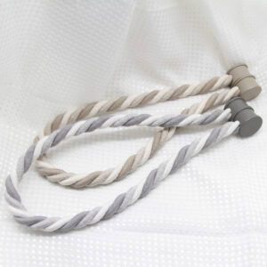 Two tiebacks side by side — beige/cream and gray/white colorways