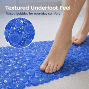 Bare feet standing on a textured surface with raised dots
