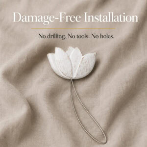 installation: White resin tulip tieback resting on soft linen with its twisted cable loop, illustrating tool free installation with no drilling or holes.