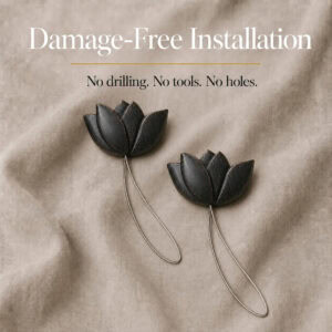 installation: Two black resin tulip tiebacks resting on soft linen with twisted cable loops, illustrating tool free installation with no drilling or holes.