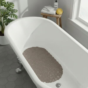 Taupe bath mat placed in white bathtub
