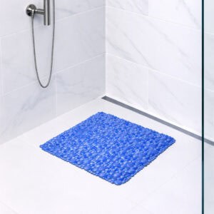 Navy blue bubble-pattern shower mat on tile shower floor