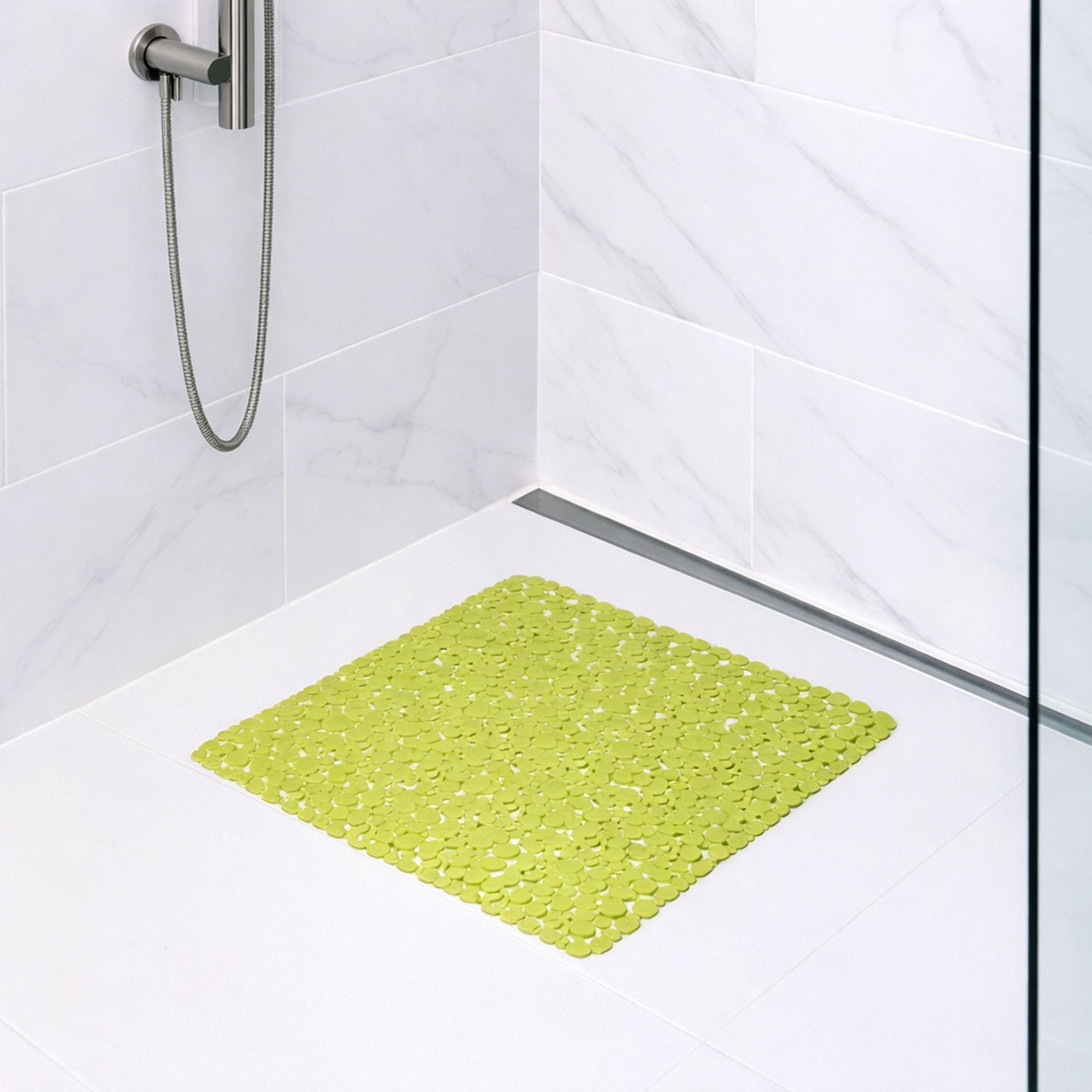 Lime bubble-pattern shower mat on tile shower floor