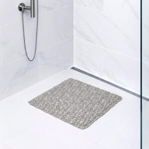 Taupe bubble-pattern shower mat on tile shower floor