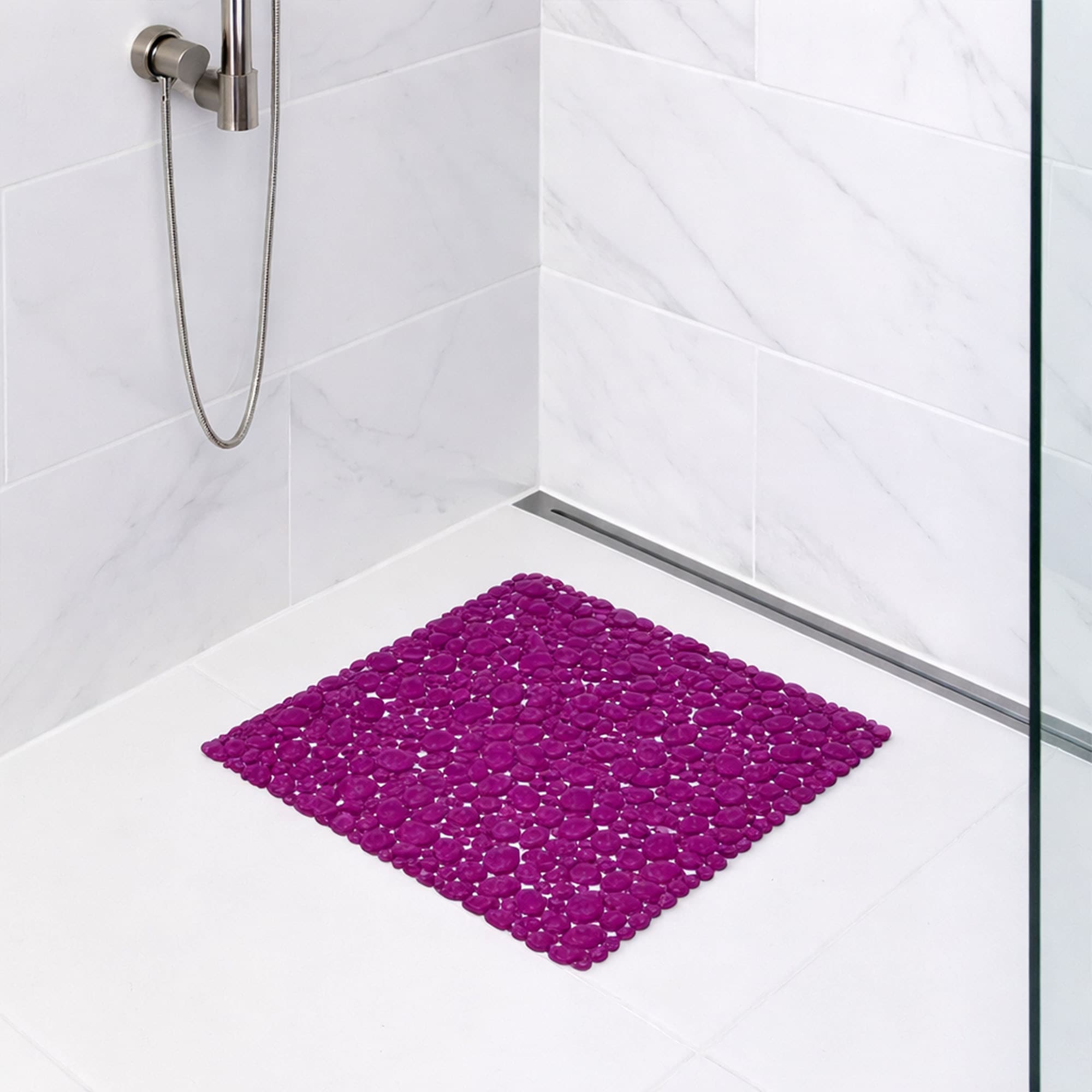 Purple bubble-pattern shower mat on tile shower floor