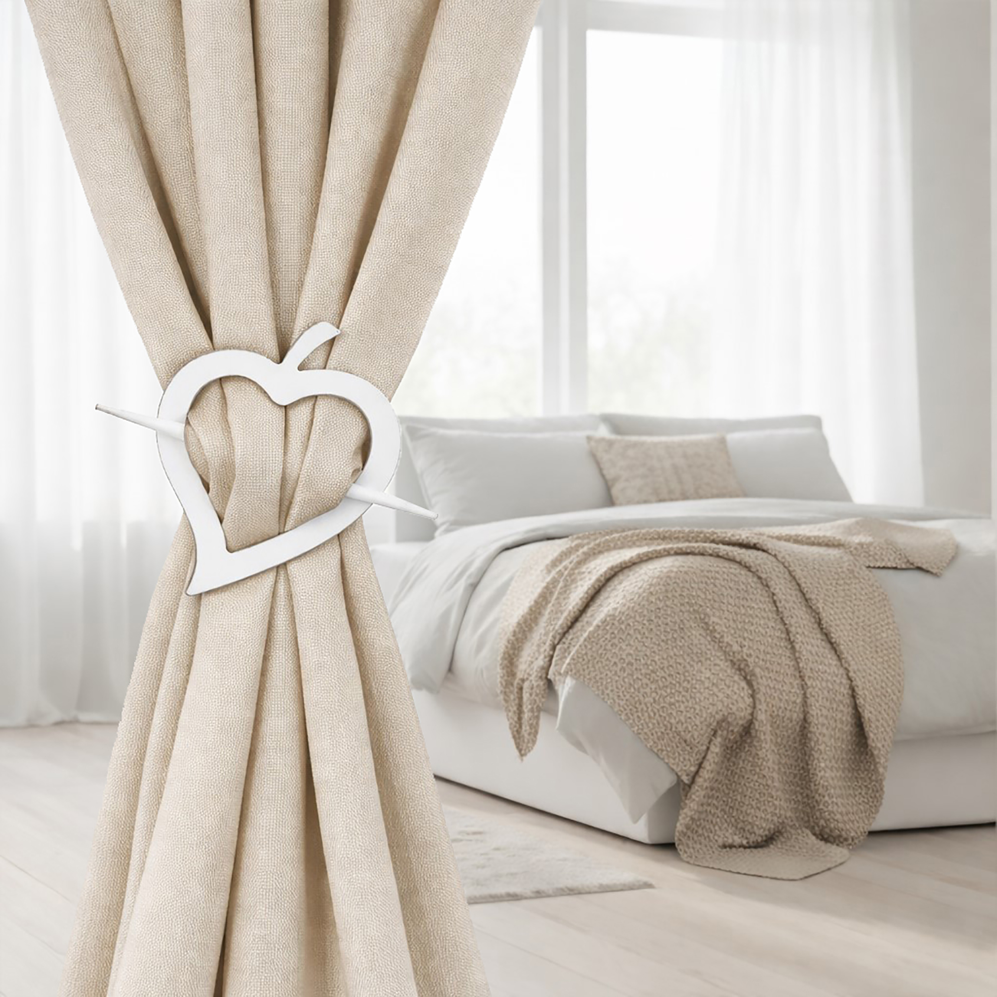 "White heart curtain tieback on linen drape in minimalist bedroom"