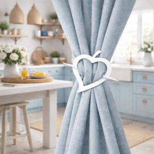 "White heart tieback on blue curtain in cottage-style kitchen"