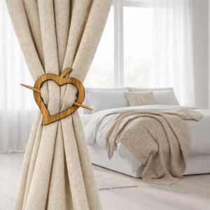 "Natural wood heart tieback on linen drape in minimalist bedroom"