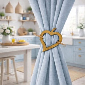 "Natural wood heart tieback on blue curtain in cottage-style kitchen"