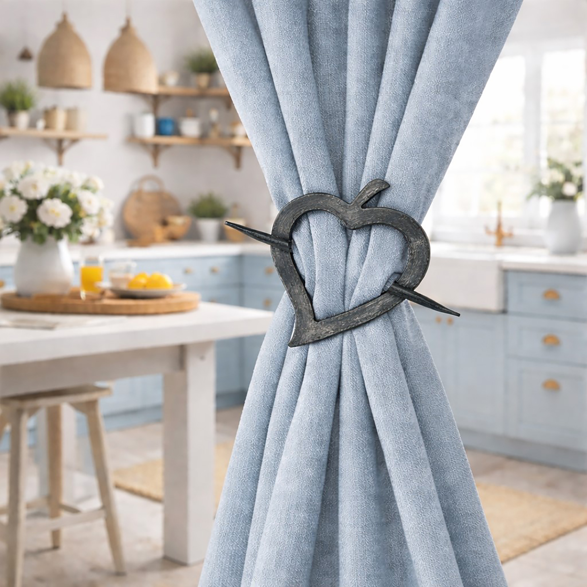 "Gray washed heart tieback on blue curtain in cottage-style kitchen"