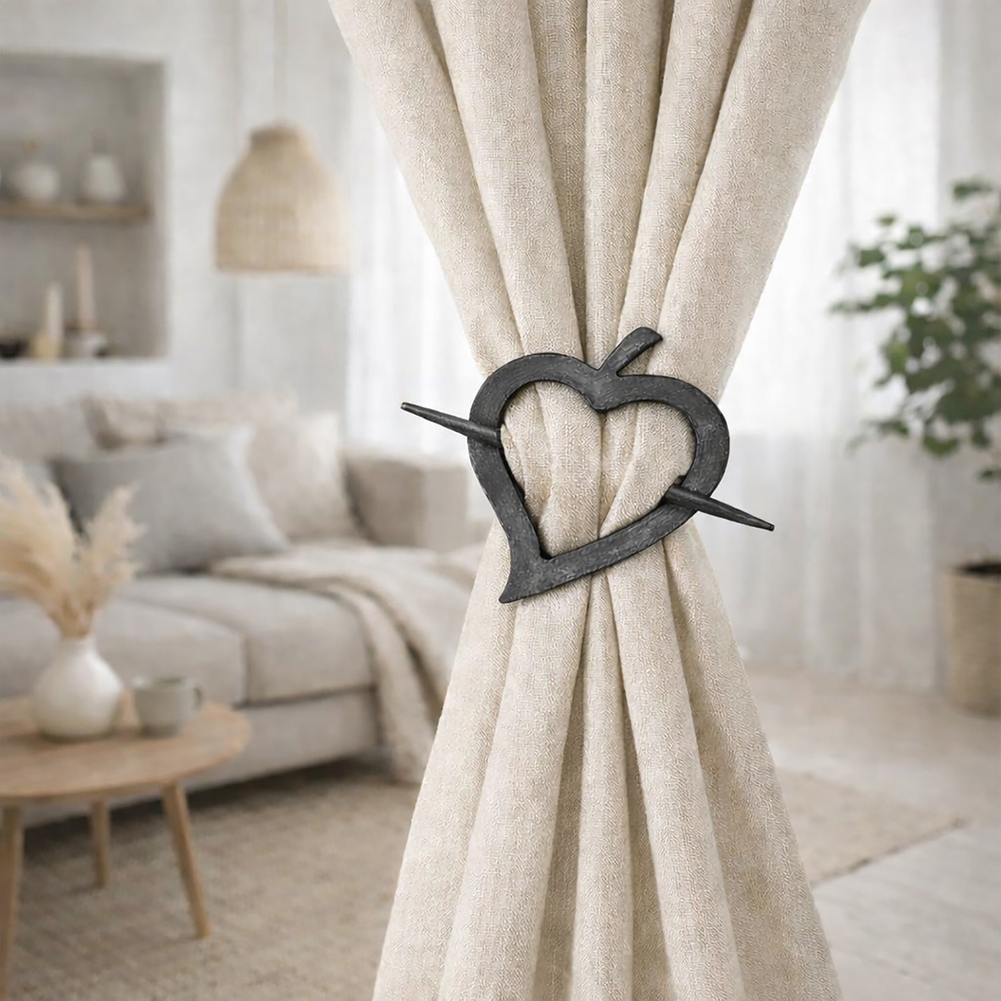 "Gray washed wooden heart tieback holding beige curtain in bright living room"