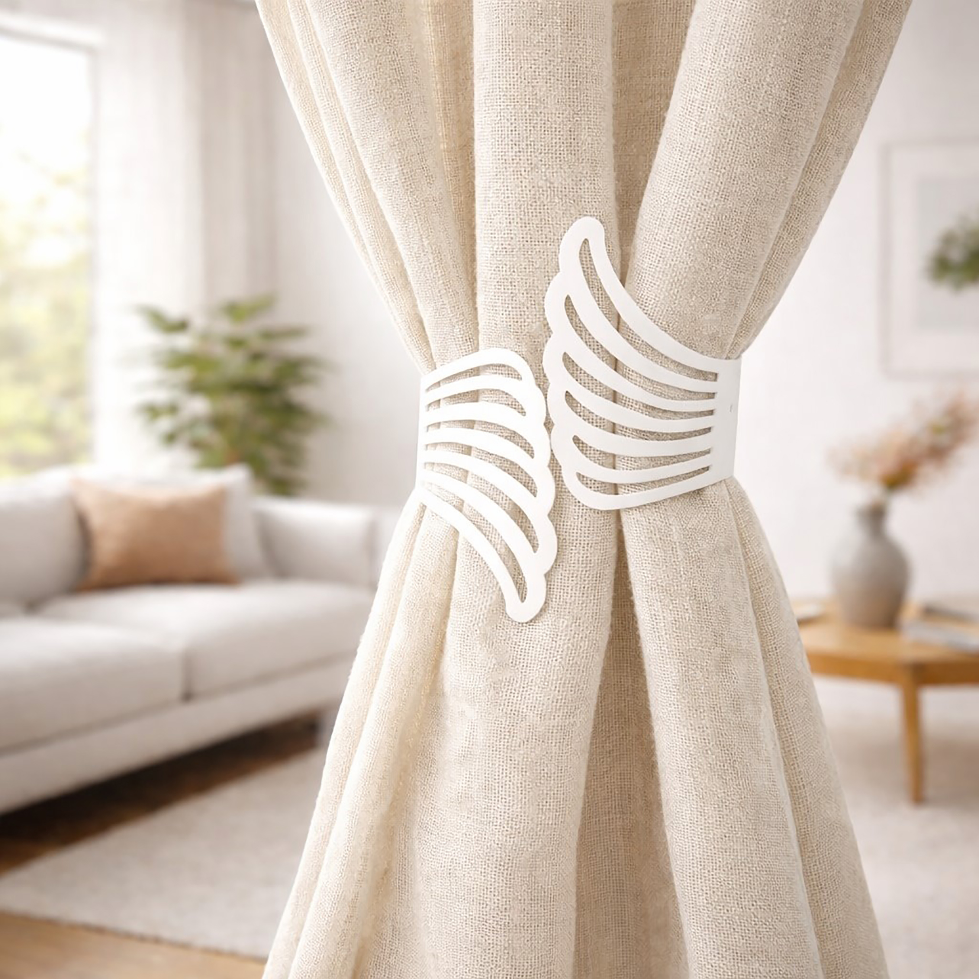 "White metal wings tieback holding cream curtains in a modern living room"