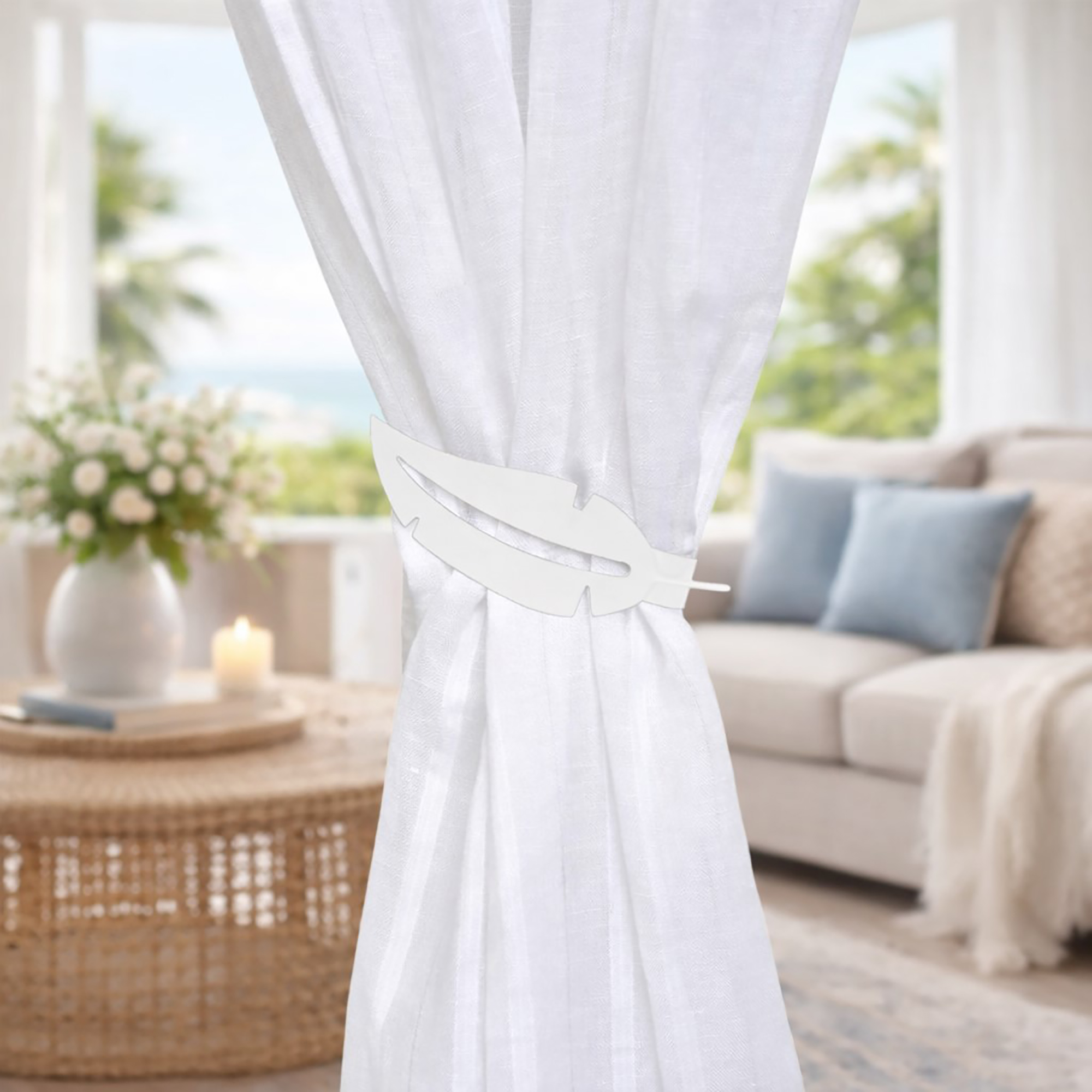 "White feather tieback on sheer white curtain in coastal living room"