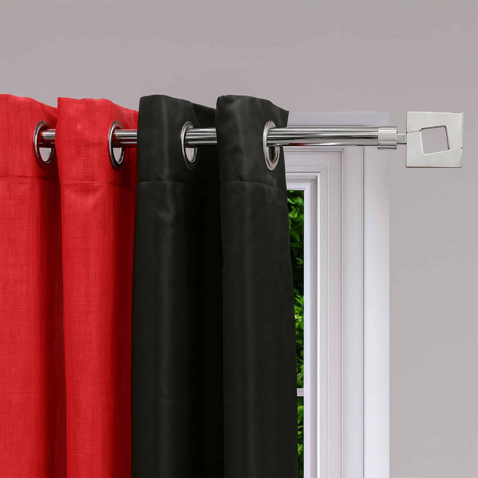Black graphite adjustable curtain rod with square finials holding red and black grommet curtains
